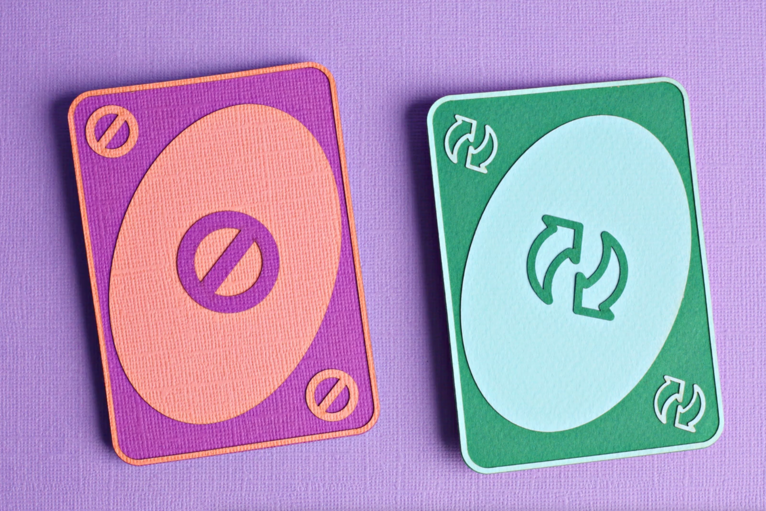 Two uno cards represent the difference between a receding hairline and a maturing hairline
